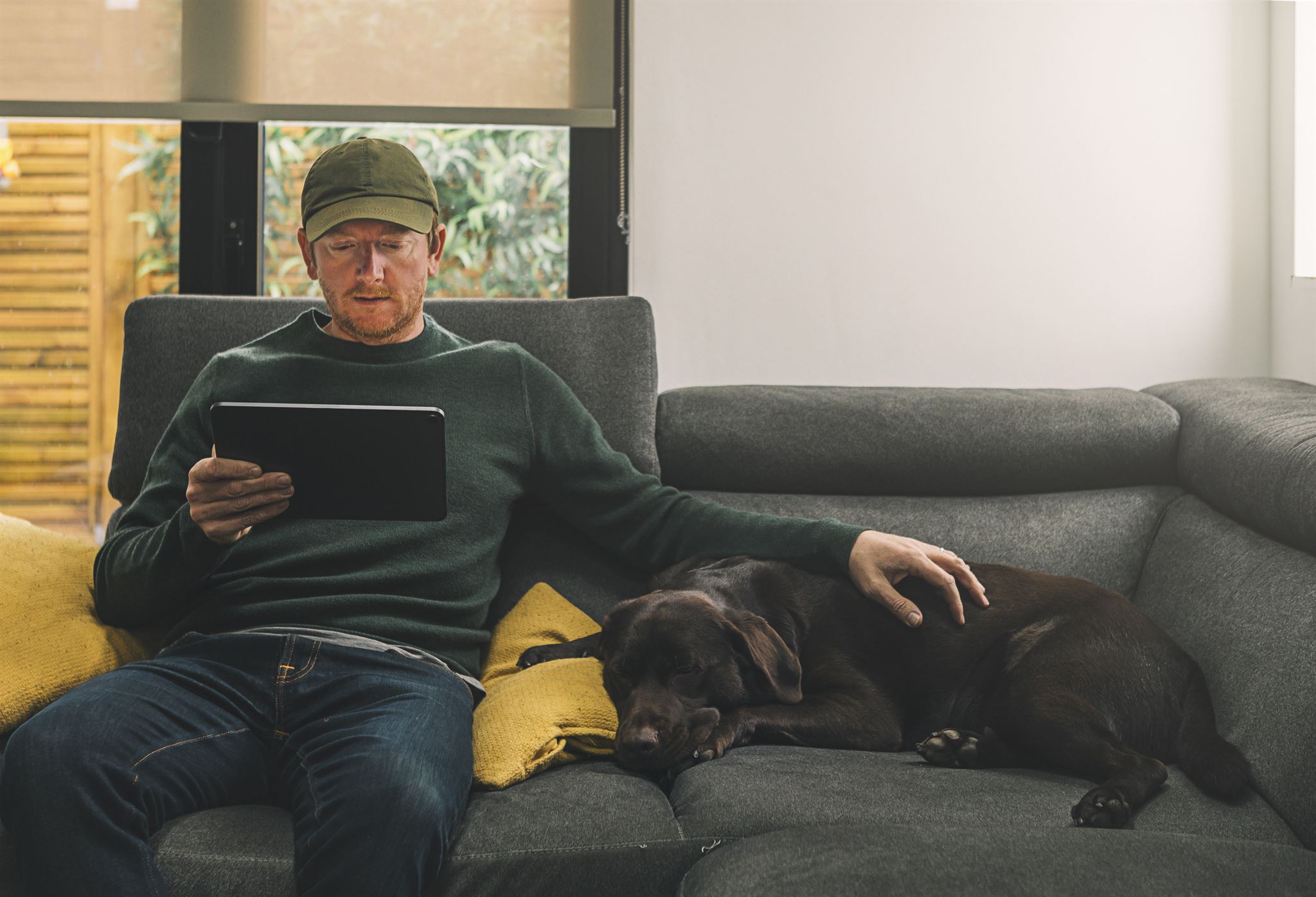 Man-relaxing-with-dog